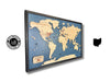Wooden world travel map with pins to track travels. 