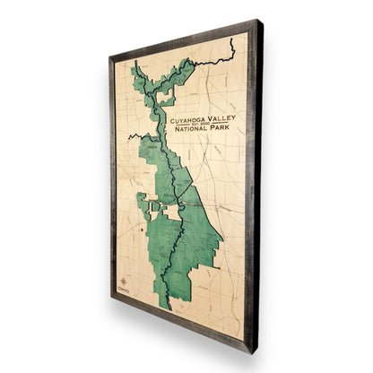 Sideview of a wooden map of Cuyahoga Valley National Park on a white background.