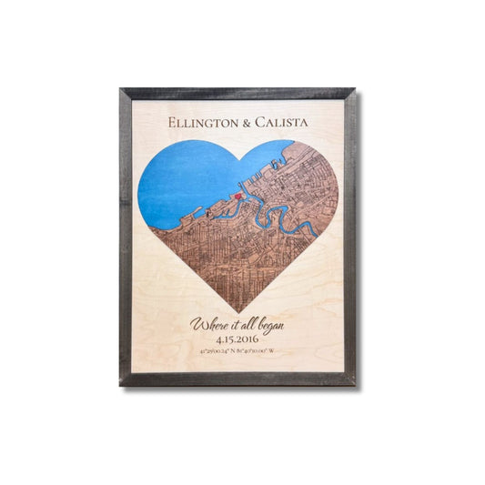 Framed 3D wooden map shaped like a heart with a raised red heart icon and personalized text.