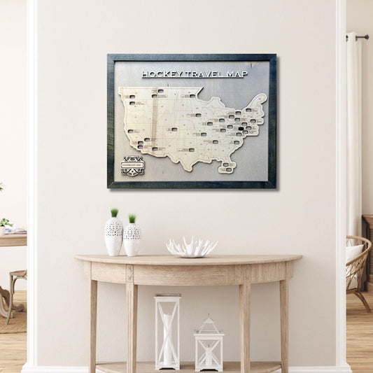 Wooden Hockey Arena Travel map hanging on a wall above a wooden table with decorative items. 