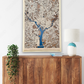 A large wooden Washington D.C. city map hanging on the wall above a dresser. 