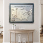 A large wooden hockey arena travel map with removable hockey puck icons. It's hanging on a wall above a table. 